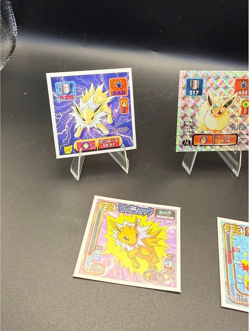 Vintage Japanese Pokémon Eeveelution sticker lot featuring Jolteon, Flareon, and